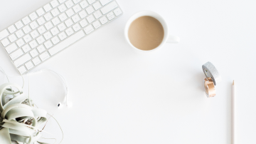 flat lay view of coffee and office supplies